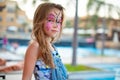 Face painting pink butterfly on little girl Royalty Free Stock Photo