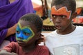 Face painting to local kids in Zanzibar