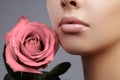 Face part. Beautiful female lips with natural makeup, clean skin. Macro shot of female lip, clean skin. Fresh kiss.