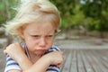 Face portrait of annoyed, unhappy caucasian kid with crossed arms Royalty Free Stock Photo