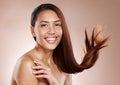 Face portrait, beauty and hair care of woman in studio on a brown background. Skincare, makeup cosmetics and happy Royalty Free Stock Photo