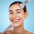 Face portrait, beauty and makeup brush of woman in studio isolated on blue background. Aesthetics, facial treatment or Royalty Free Stock Photo