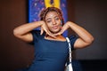 Face portrait of lovely african american woman with dreadlocks at cafe. Beautiful cool fashionable black young girl indoor Royalty Free Stock Photo