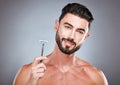 Face, portrait and man with razor in studio isolated on a gray background for shaving. Skincare, cleaning and male model