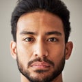 Face, portrait and serious asian man in studio with focus, wellness and awareness. Headshot of a young male model Royalty Free Stock Photo