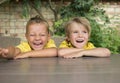 face portrait of two cute laughing boy 5 years old Royalty Free Stock Photo