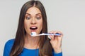 Face portrait of woman smiling with teeth holding toothy brush. Royalty Free Stock Photo