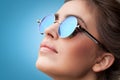 Face portrait of young beautiful woman in round sunglasses