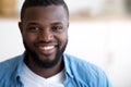 Face portrait of young smiling african american man in office Royalty Free Stock Photo