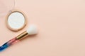 Face powder with brush on pink background. Copy space. Flat lay. Top view. Skin care or morning routine concept Royalty Free Stock Photo