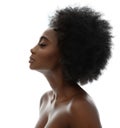 Face Profile of African Beauty Woman with Afro Hairstyle. Dark Skinned Model Side view Portrait over White Background. Women Royalty Free Stock Photo