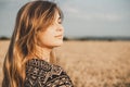 Face profile of romantic young woman enjoying sunset on wheat field, girl breathe breathes deeply , freedom and relaxation concept Royalty Free Stock Photo