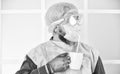 Face protection goggles mask gloves head cover. Personal protective equipment. Guy in mask drink tea coffee using straw