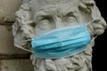 Face protection mask on Gypsum copy of ancient statue Homer head