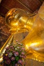 Face of Reclining Buddha gold statue in Bangkok, Thailand Royalty Free Stock Photo