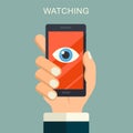 Face recognition, surveillance concepts. Hand holding smartphone with watching eye on screen. Mobile phone with eye icon. Modern f Royalty Free Stock Photo