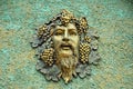 Face relief sculpture on retro concrete wall Royalty Free Stock Photo