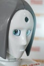 Face robot with green eyes.