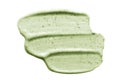 Face scrub creamy texture. Green natural cosmetic exfoliation cleanser smear smudge isolated on white. Facial mask sample