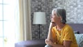 Face of senior caucasian hoary woman looking away deep in sad thoughts feels lonely close up portrait, recollect memories and life