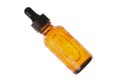 Amber glass bottle with a white background holding a facial serum, essential oil, or prescription medicine. view from above