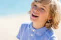 Face shot of laughing boy outdoors. Royalty Free Stock Photo