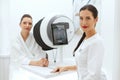 Face Skin Analyze. Cosmetologist Analyzing Woman Facial Skin