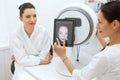 Face Skin Analyze. Cosmetologist Analyzing Woman Facial Skin