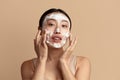 Face Skin Care. Asian Woman Cleaning Facial Skin with Foam Soap Royalty Free Stock Photo