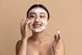 Face Skin Care. Asian Woman Cleaning Facial Skin with Foam Soap Royalty Free Stock Photo