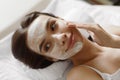 Face Skin Care. Beautiful Woman With Facial Cosmetic Mask At Spa Royalty Free Stock Photo