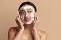 Face Skin Care. Cute Asian Woman Cleaning Facial Skin with Foam Soap Royalty Free Stock Photo