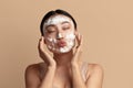 Face Skin Care. Funny Asian Woman Cleaning Facial Skin with Foam Soap Royalty Free Stock Photo