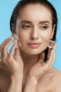 Face Skin Care. Woman Applying Ice Cubes Royalty Free Stock Photo