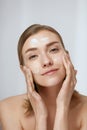 Face skin care. Woman cleaning facial skin with foam soap Royalty Free Stock Photo