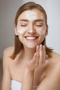 Face skin care. Woman cleaning facial skin with foam soap Royalty Free Stock Photo