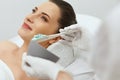 Face Skin Care. Woman Doing Alginate Facial Mask At Cosmetology