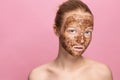 Face Skin Scrub. Portrait Of Smiling Female Model Applying Natural Coffee Mask, Face Scrub On Facial Skin. Closeup