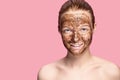 Face Skin Scrub. Portrait Of Smiling Female Model Applying Natural Coffee Mask, Face Scrub On Facial Skin. Closeup Royalty Free Stock Photo