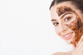 Face Skincare. Young charming girl makes a black charcoal mask o Royalty Free Stock Photo