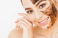 Face Skincare. Young charming girl makes a black charcoal mask o Royalty Free Stock Photo