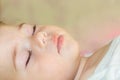 Face of a sleeping baby boy girl close-up. Portrait of a Caucasian child with closed eyes Royalty Free Stock Photo