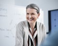 Face, smile and mature businesswoman in boardroom, meeting and professional in office workshop. Management, ceo or Royalty Free Stock Photo