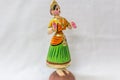 Face of a Thanjavur dancing doll Called as Thalaiyatti Bommai in Tamil language with look alike traditional dress and oranments Royalty Free Stock Photo