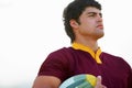 Face, thinking and male rugby player with a ball for competitive game strategy on a white background. Vision, idea and