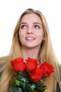 Face of thoughtful happy teenage girl smiling while holding red Royalty Free Stock Photo