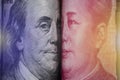 Face to face of Benjamin Franklin and Mao Tse tung from US dollar and China Yuan banknote. It is symbol of economic tariffs trade