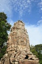 Face tower of the Ta Prohm temple in Angkor area, Cambodia. Royalty Free Stock Photo