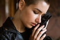 Face an unhappy young woman with short haircut is crying, close-up eyes Royalty Free Stock Photo