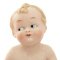 Face of vintage baby doll from ceramics closeup, isolated on white background Royalty Free Stock Photo